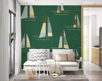 Wall mural showing mid century sailboat on deep green ground.
