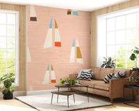 Peach wall mural with scattered sailboat motifs and white wave lines.