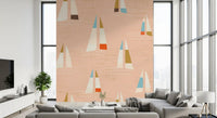 Peach sailboat wall mural with red-orange and olive colour block accents.