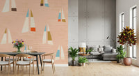 Repeat pattern sailboat wall mural in soft peach ground with mid century boats.