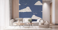 Retro style white clouds and birds on dusty blue wall mural for living room.