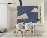 Small and large clouds scattered across dusty blue wall mural.