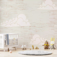 Nursery wall with mid century cream cloud sky mural.