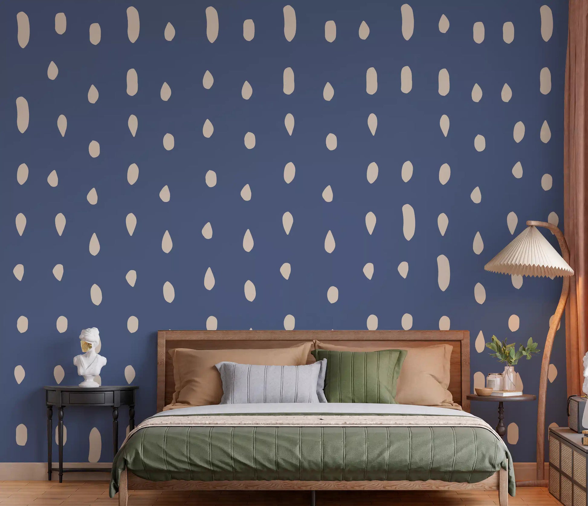 Bedroom wall with dusty blue seed dot pattern mural.