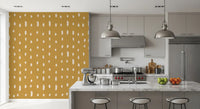 Cream seed-shaped dots scattered across mustard wall mural., GD10570