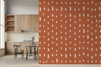 Pale cream dots on burnt terracotta wall mural with med century design., GD10573