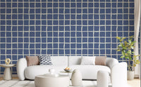 Dusty blue wavy grid wallpaper in a contemporary living room.