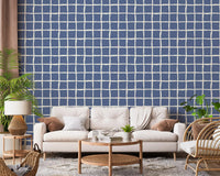 Geometric blue grid wallpaper with uneven square shapes.