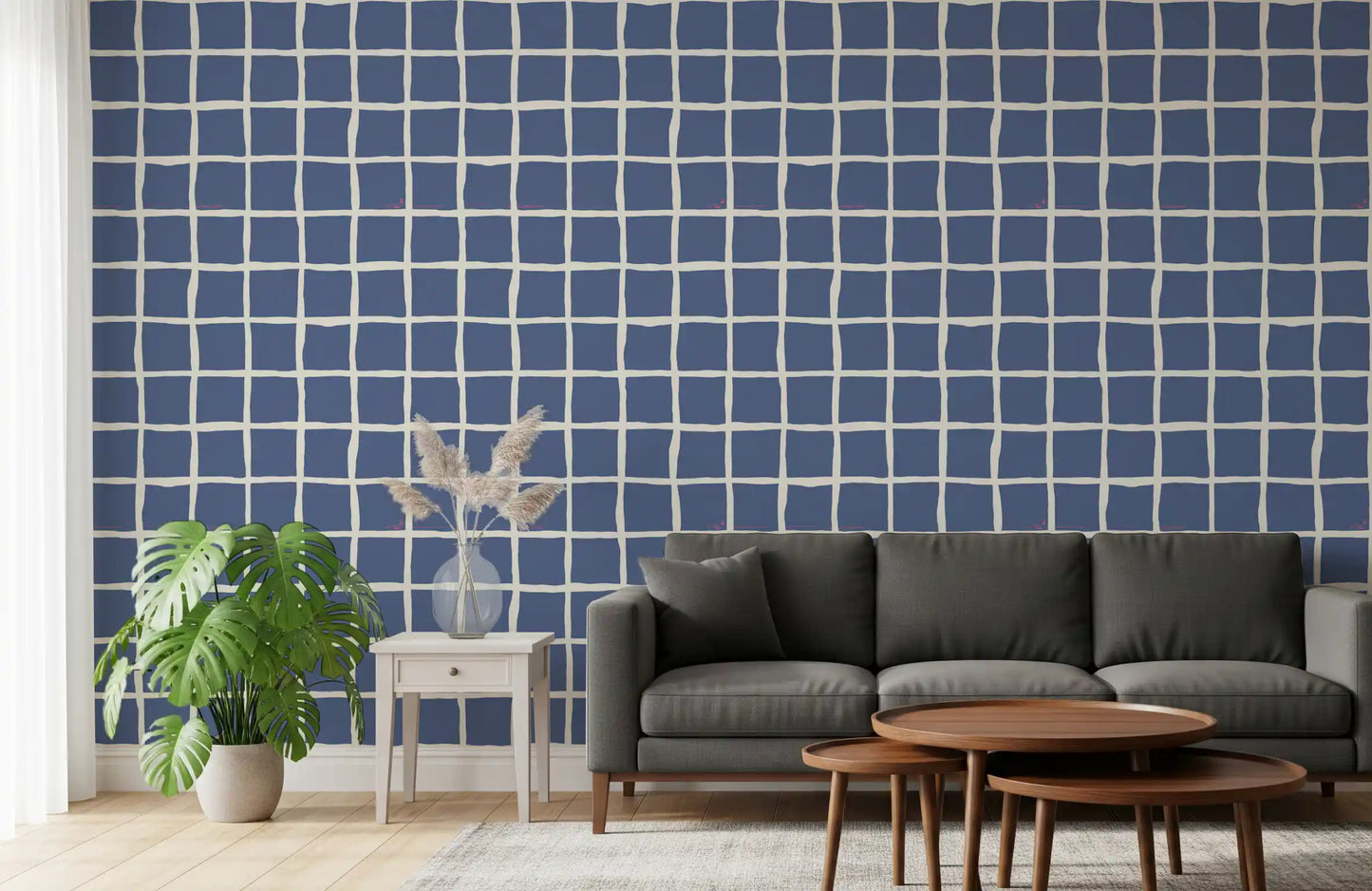Cream wavy lines on muted blue background wallpaper in living room.