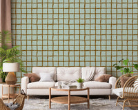 Mid century sage and brown grid wallpaper in a living room.