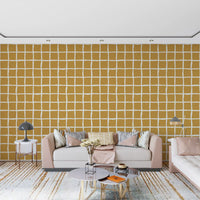 Mid century geometric grid pattern wallpaper in mustard tones.