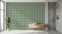 Geometric sage grid wallpaper with uneven organic squares in bathroom.