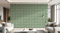 Wavy white lines forming irregular grid on sage green wallpaper.