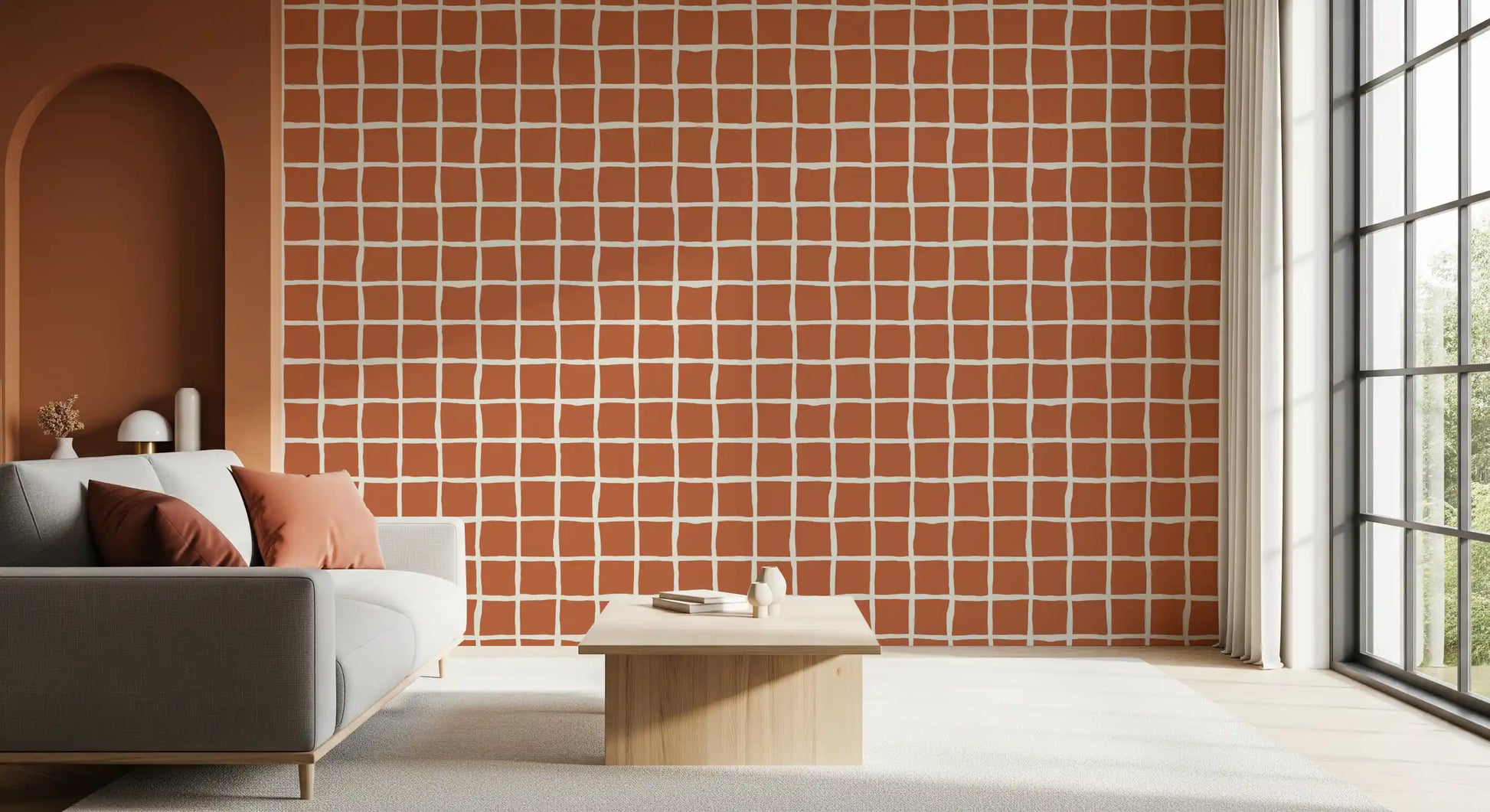 Burnt orange and off-white grid pattern wallpaper in bright seating area.