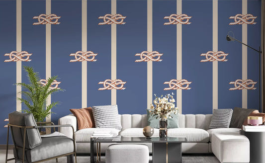 Dusty blue nautical wallpaper with rope knots in a living room setting.