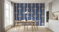 Terracotta and white sailor knots on blue striped wallpaper in dining room.