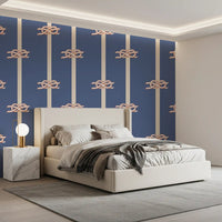 Vertical cream stripes with rope knot motifs on blue nautical wallpaper for bedroom.