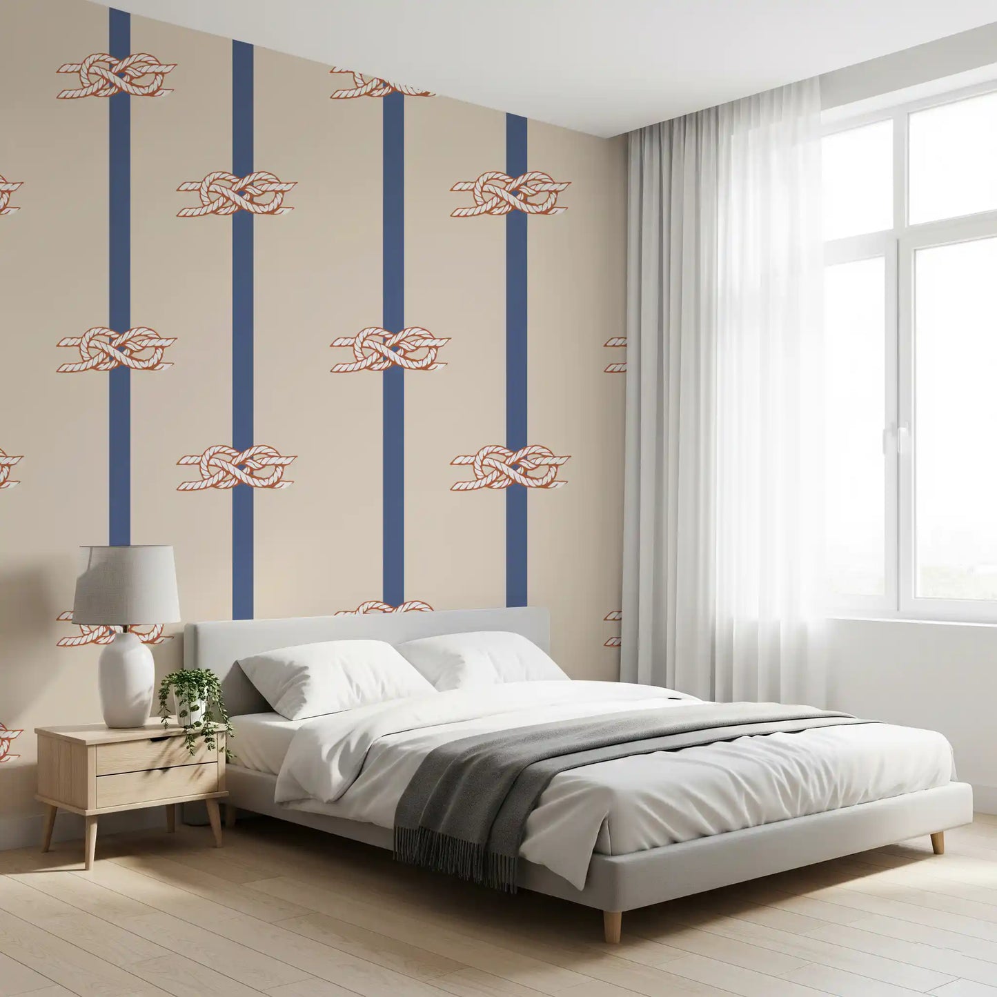Beige and navy striped wallpaper with repeating nautical rope knot motifs in bedroom.