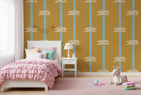 Repeating nautical rope and stripe wallpaper in mustard and blue tones in kids bedroom.