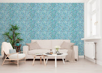 Aqua knit cascade wallpaper with paired leaf motifs in multiple blue shades.