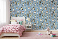 Penguin family wallpaper adding a playful touch to a kids bedroom wall.
