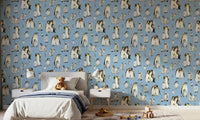 Soft blue penguin pattern wallpaper displayed in a children's bedroom.