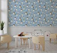 Speckled blue wallpaper with Grey and black penguins with yellow patches.