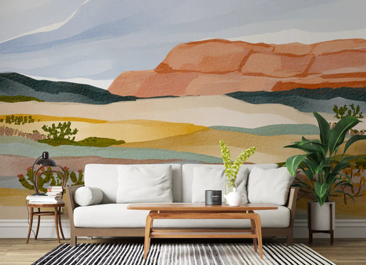 Desert landscape mural in living room with golden ochre and teal tones.
