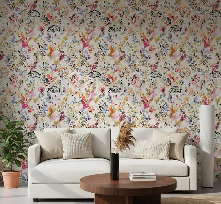 Watercolour wildflower meadow wallpaper in a bright living room.
