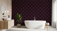 Metallic gold circles with central diamonds on plum wallpaper in bathroom., GD10645