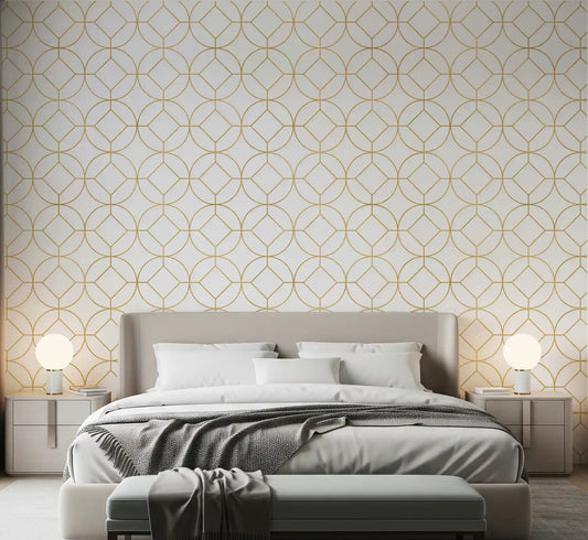 Metallic gold circle lattice wallpaper displayed in a bright bedroom.