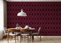 Gold leaf pattern wallpaper on burgundy displayed in a styled dining room., GD10648