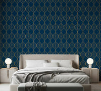 Gold leaf pattern on navy wallpaper displayed in a styled bedroom., GD10649