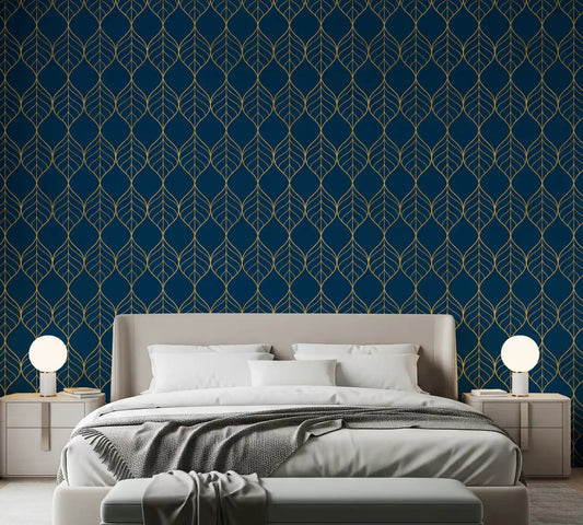 Gold leaf pattern on navy wallpaper displayed in a styled bedroom.