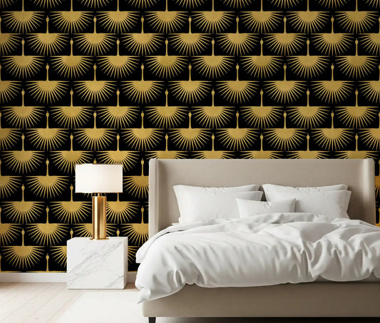Textured gold crane pattern on black wallpaper in a styled bedroom.