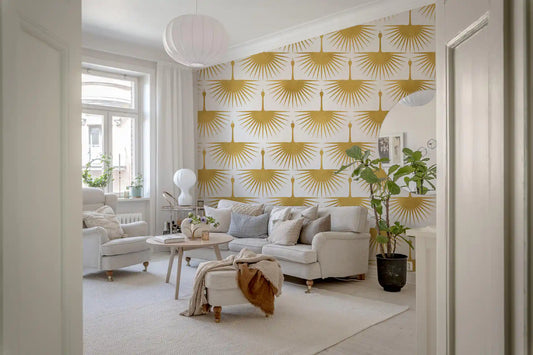 Wallpaper showing gold sunburst crane motifs with spread wings on white surface.
