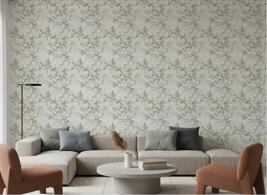 Living room feature wall with sage green botanical leaf and blush berry wallpaper.