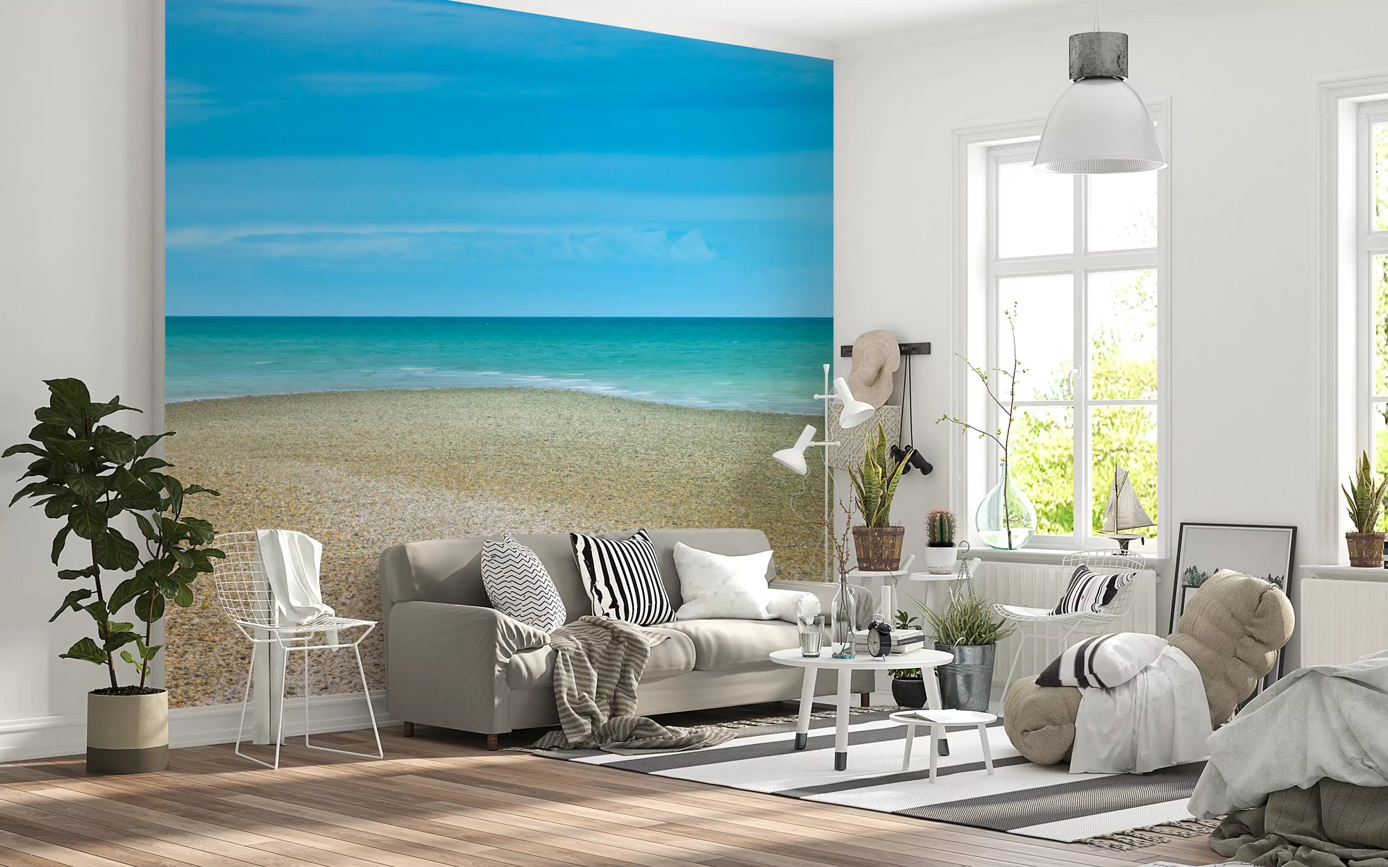 Turquoise sea mural with soft pebble shoreline and wide pale sky in living room GD10910