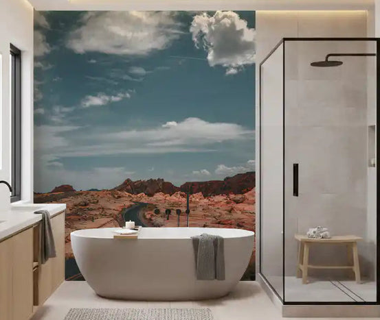 Winding desert highway wall mural with asphalt road and red rock ridges in bathroom GD11046