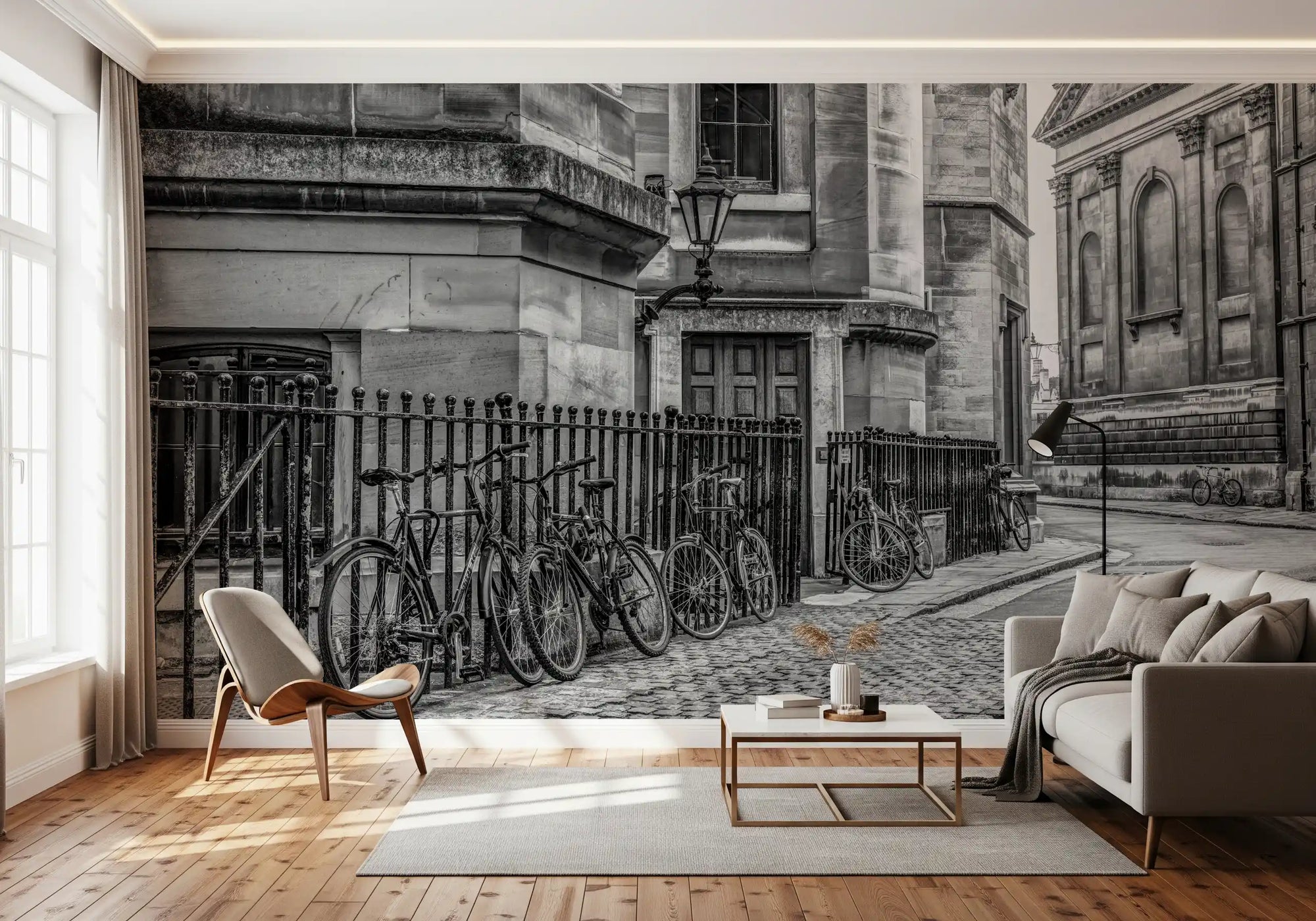 Black and white cobbled street mural with vintage cycles by iron railings in living room GD11150