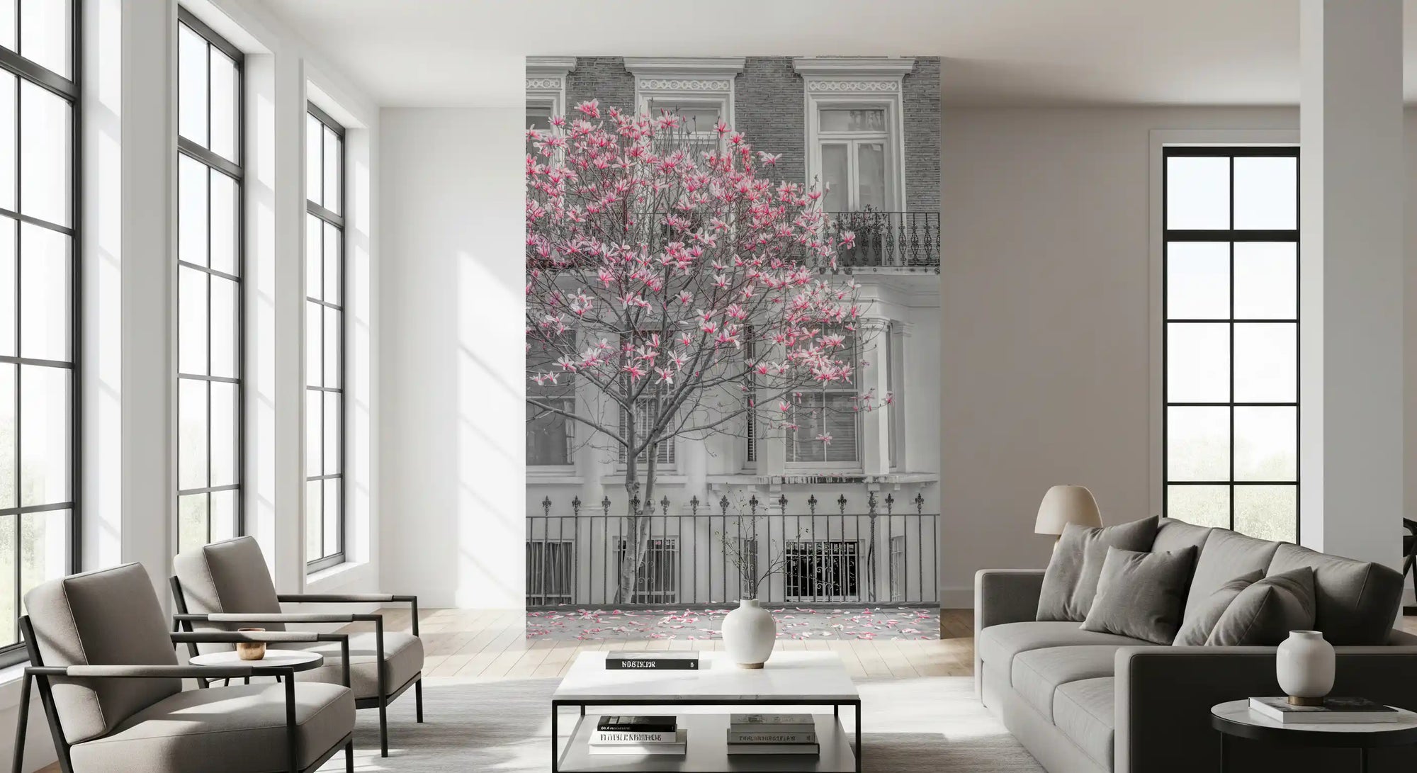 Pink magnolia blossom wall mural against a greyscale townhouse in living room GD11159