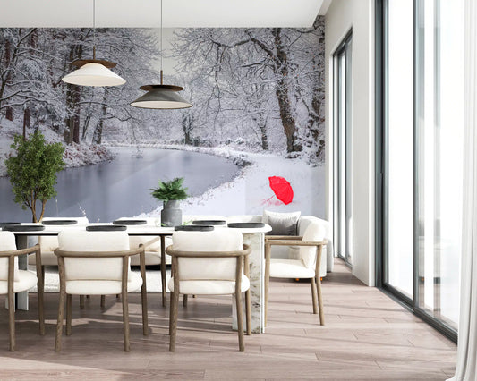 Winter forest wall mural with a red umbrella on a snowy riverbank GD11174