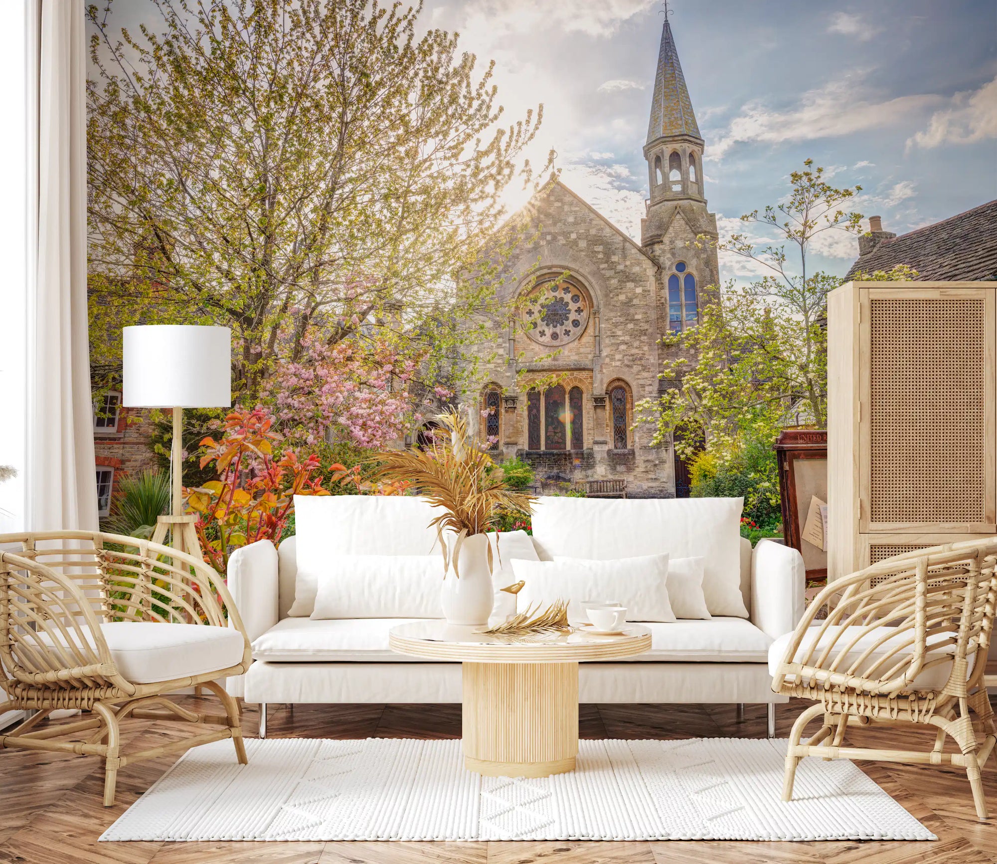 Church garden wall mural with stone chapel and tall spire in spring light GD11180