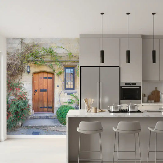 Arched wooden door mural set in a honey-toned stone cottage wall GD11219