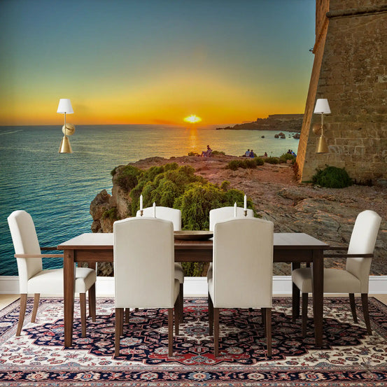 Golden hour coastal cliff mural with sun setting over calm sea in dining room GD11419