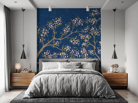Pink blossom branches with pale petals on a deep blue background wall mural for bedroom GD11510
