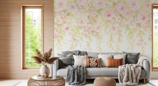 Blush pink rose wall mural with trailing green foliage in living room GD11547