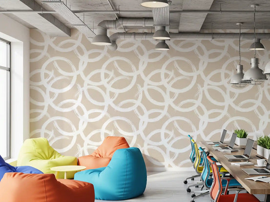 Cream brushstroke circles wallpaper with overlapping white rings in office GD11737