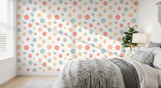 Floral wallpaper with coral, peach and blue daisy blooms on bedroom wall GD11747