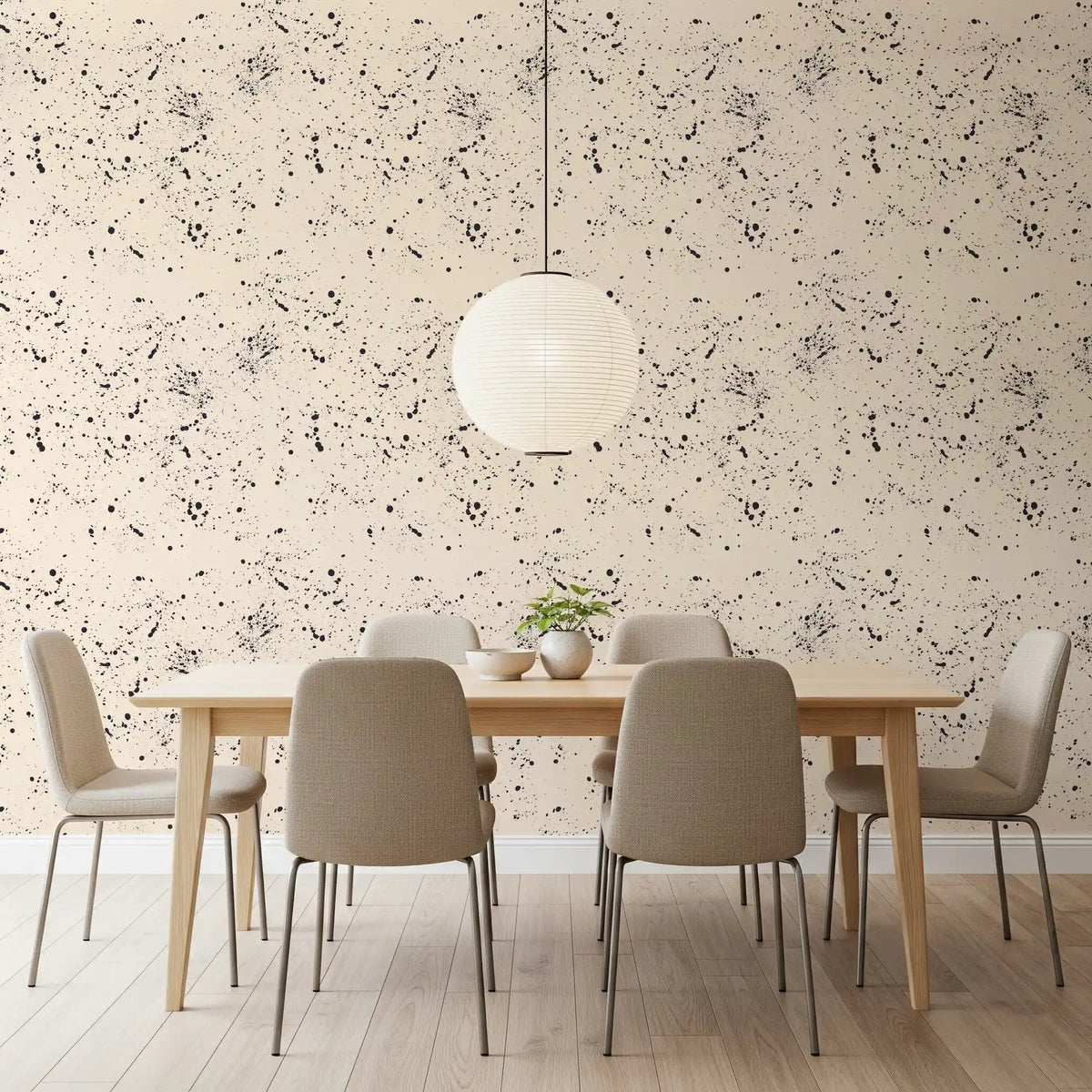 Black ink splatter wallpaper behind a wooden dining table GD11832